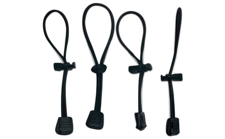Elastic Cinch Cords Looped Through A Small Plastic Barrel Piece